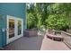 Expansive deck with seating area surrounded by lush greenery, ideal for entertaining at 7508 Venture Ct, Raleigh, NC 27615