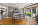 Bright dining room with a glass table and large window at 7508 Venture Ct, Raleigh, NC 27615