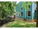 Exterior of a home with green siding, complemented by a neatly manicured lawn at 7508 Venture Ct, Raleigh, NC 27615