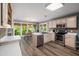 Open kitchen with stainless steel appliances and a breakfast nook overlooking the backyard at 7508 Venture Ct, Raleigh, NC 27615