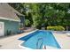Private in-ground pool in a lush backyard setting, ideal for summer enjoyment at 7508 Venture Ct, Raleigh, NC 27615