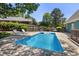 Backyard pool with blue water and lounge chairs on the surrounding concrete patio at 7508 Venture Ct, Raleigh, NC 27615