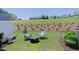 Backyard featuring comfortable seating, a lush lawn, and landscaping elements at 79 Hawkstone Dr, Clayton, NC 27527