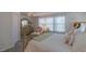 Comfortable bedroom with soft carpet, a large bed, sheer curtains, and ample natural light from the windows at 79 Hawkstone Dr, Clayton, NC 27527