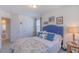 Comfortable bedroom featuring a queen bed, neutral colors, and natural lighting at 79 Hawkstone Dr, Clayton, NC 27527