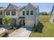 An angled view shows the home's manicured lawn, attached garage, and desirable location in a neighborhood at 79 Hawkstone Dr, Clayton, NC 27527