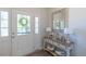 Bright foyer with hardwood floors, a decorative front door, and an elegant accent table at 79 Hawkstone Dr, Clayton, NC 27527