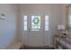 Bright foyer featuring a decorative front door, hardwood floors, and a stylish accent table at 79 Hawkstone Dr, Clayton, NC 27527