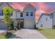Charming two-story home with a well-manicured lawn and attached garage in a residential neighborhood at 79 Hawkstone Dr, Clayton, NC 27527