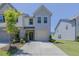 Charming two-story home with a well-manicured lawn and attached garage in a residential neighborhood at 79 Hawkstone Dr, Clayton, NC 27527