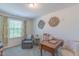 Bright home office featuring a window view and a comfortable seating area at 79 Hawkstone Dr, Clayton, NC 27527