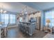 Eat-in kitchen featuring a breakfast bar with seating, stainless steel appliances, and modern finishes at 79 Hawkstone Dr, Clayton, NC 27527
