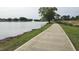 Scenic walking trail along the pond, surrounded by trees and greenery at 79 Hawkstone Dr, Clayton, NC 27527