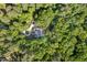 Aerial view of the property with mature trees surrounding the house at 800 Oxbow Crossing Rd, Chapel Hill, NC 27516
