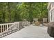 A beautiful back deck features an outdoor grill and plenty of space for entertaining at 800 Oxbow Crossing Rd, Chapel Hill, NC 27516