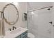 Elegant bathroom with a sink vanity, framed mirror, and a tiled shower with a glass door at 800 Oxbow Crossing Rd, Chapel Hill, NC 27516