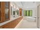 Modern bathroom featuring a soaking tub, dual vanities, and sleek contemporary design at 800 Oxbow Crossing Rd, Chapel Hill, NC 27516