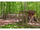 Backyard chicken coop featuring fencing, a covered area, and colorful decorative accents at 800 Oxbow Crossing Rd, Chapel Hill, NC 27516