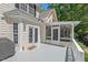 Rear view of the property featuring a deck and screened in porch at 800 Oxbow Crossing Rd, Chapel Hill, NC 27516