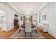Elegant dining room with coffered ceilings, chandelier, and large windows at 800 Oxbow Crossing Rd, Chapel Hill, NC 27516
