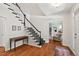 Bright foyer with hardwood floors and staircase, leading into a cozy living room at 800 Oxbow Crossing Rd, Chapel Hill, NC 27516