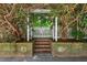 Charming garden gate with brick steps and decorative elements, creating a welcoming entrance at 800 Oxbow Crossing Rd, Chapel Hill, NC 27516