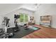 Bright home gym features exercise equipment, a large window, and a dedicated workspace at 800 Oxbow Crossing Rd, Chapel Hill, NC 27516