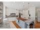 Gourmet kitchen featuring granite countertops, wood island, stainless steel appliances, and wood floors at 800 Oxbow Crossing Rd, Chapel Hill, NC 27516