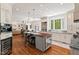 Modern kitchen with granite countertops, stainless steel appliances, and large island at 800 Oxbow Crossing Rd, Chapel Hill, NC 27516