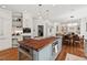 Gourmet kitchen featuring a wood-topped island, stainless steel appliances, and open layout at 800 Oxbow Crossing Rd, Chapel Hill, NC 27516