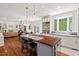 Spacious kitchen with island, granite counters, bay window, and an open floor plan at 800 Oxbow Crossing Rd, Chapel Hill, NC 27516