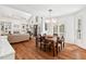 Open floor plan featuring a dining area, living room with fireplace, and wood floors at 800 Oxbow Crossing Rd, Chapel Hill, NC 27516