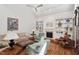 Bright living room with hardwood floors, built-in shelving, and comfortable seating arrangement at 800 Oxbow Crossing Rd, Chapel Hill, NC 27516