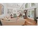 Bright living room with fireplace, built-in shelving, hardwood floors and large windows at 800 Oxbow Crossing Rd, Chapel Hill, NC 27516