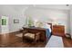 Spacious bedroom featuring hardwood floors, a large window, and neutral decor at 800 Oxbow Crossing Rd, Chapel Hill, NC 27516