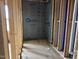 Unfinished bathroom with exposed framing, blue insulation, and plumbing fixtures at 803 Fireship Rd, Fuquay Varina, NC 27526