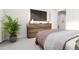 Relaxing bedroom with a large dresser, TV, and a cozy bed for a comfortable and stylish space at 803 Fireship Rd, Fuquay Varina, NC 27526
