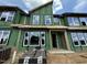 Modern home exterior featuring large windows and a contemporary design, showcasing its curb appeal at 803 Fireship Rd, Fuquay Varina, NC 27526
