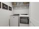 Efficient laundry room with modern washer and dryer, shelving, and organized space for easy chore management at 803 Fireship Rd, Fuquay Varina, NC 27526
