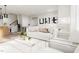 Bright living room with comfortable white sofa, stylish coffee table, and contemporary decor at 803 Fireship Rd, Fuquay Varina, NC 27526