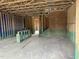 Unfinished living room showing the framing and construction stage, revealing the home's structure at 803 Fireship Rd, Fuquay Varina, NC 27526
