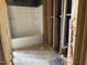 Unfinished bathroom featuring a new bathtub and shower combination with exposed pipes at 805 Fireship Rd, Fuquay Varina, NC 27526