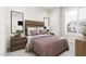 Cozy bedroom with stylish wood headboard, complementary nightstands and a bright, inviting atmosphere at 805 Fireship Rd, Fuquay Varina, NC 27526