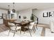 Open-concept dining room with modern table set and elegant decor, perfect for entertaining guests at 805 Fireship Rd, Fuquay Varina, NC 27526