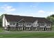 Beautiful new townhomes boast unique curb appeal with craftsman-style architecture and manicured landscaping at 805 Fireship Rd, Fuquay Varina, NC 27526