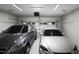 Spacious two car garage featuring overhead lighting and ample room for vehicles at 805 Fireship Rd, Fuquay Varina, NC 27526