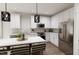 Modern kitchen features stainless steel appliances, stylish countertops, and sleek white cabinetry at 805 Fireship Rd, Fuquay Varina, NC 27526