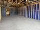 Unfinished living room featuring wood framing, blue insulation and ample space at 805 Fireship Rd, Fuquay Varina, NC 27526