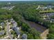 Aerial view of the community with backyard pools and lake access at 817 Highwater Pl, Fuquay Varina, NC 27526