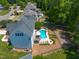 Back of a home featuring an in-ground pool, patio, and manicured landscaping at 817 Highwater Pl, Fuquay Varina, NC 27526
